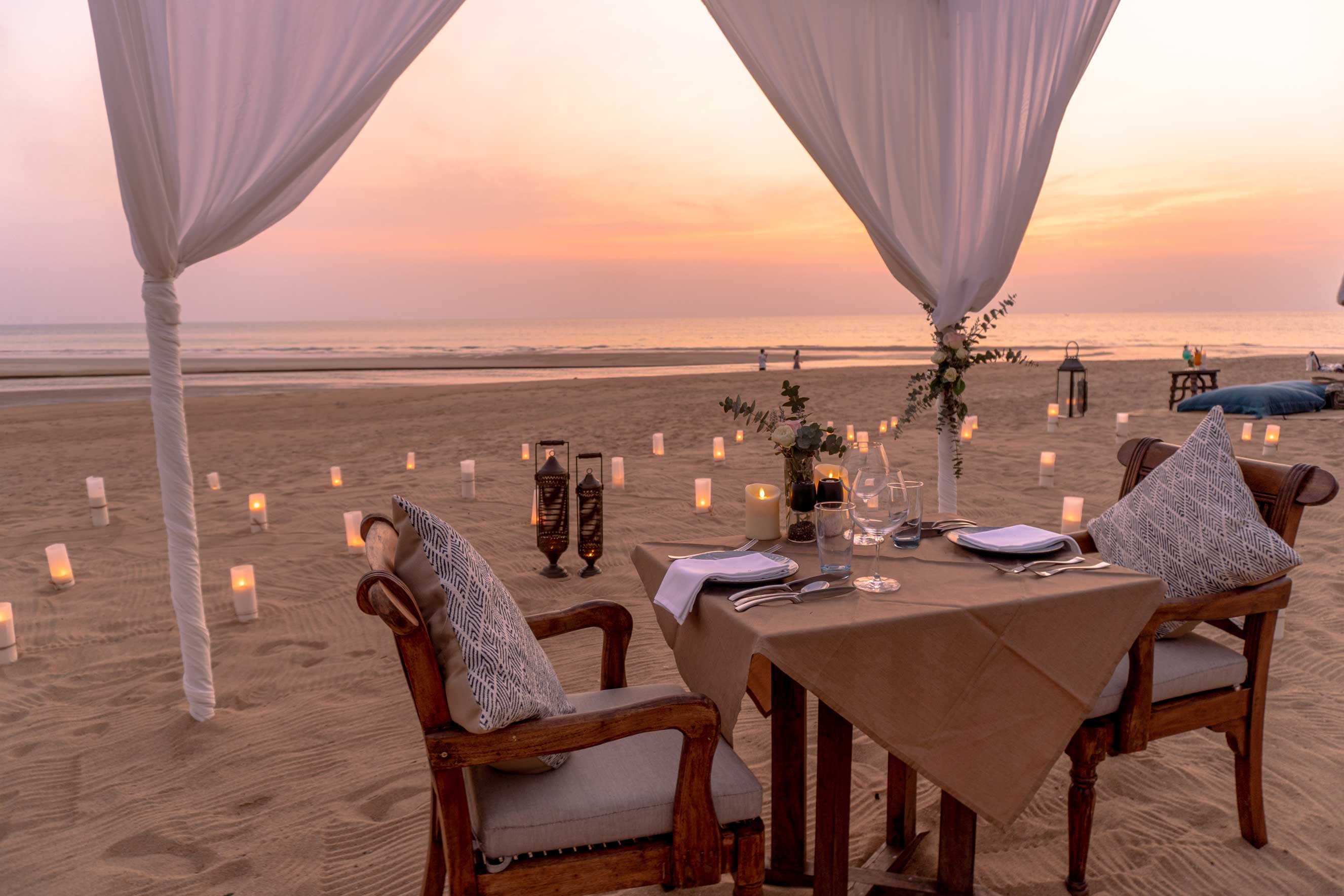 Romantic private dinner dinning on the beach with sunset view
