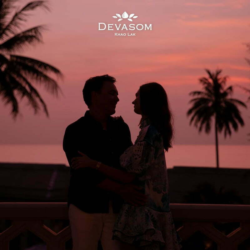 Bask in stunning pink sunset sky as a couple creating loving Valentine's memories. 